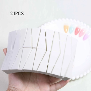 Close-up of 24pcs white wedge makeup sponges for gradient nail art and cosmetic use
