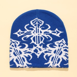 Blue knitted beanie featuring white gothic cross jacquard pattern for winter warmth