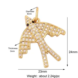 Detailed view of bird pendant with white cubic zirconia inlay and black stone eye