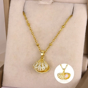 French vintage shell pendant necklace with pink pearl and zircon stones in a jewelry box
