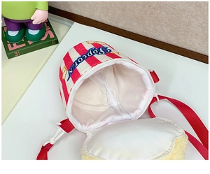 Detail view of the open striped popcorn crossbody bag showing its spacious inner lining