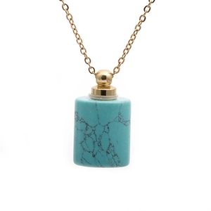 Minimalist turquoise stone perfume bottle pendant with gold chain and black veining