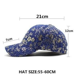 Blue denim baseball cap with gold floral embroidery and detailed size measurements