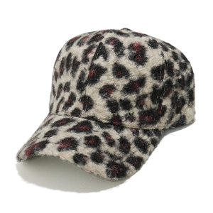 Close-up of leopard print faux shearling baseball cap showing soft fuzzy fabric texture