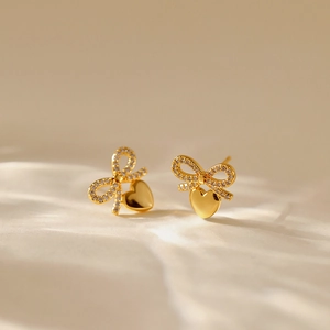Bowknot and heart stud earrings with 18K gold plating and sparkling cubic zirconia