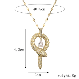 Detail of gold snake pendant with clear cubic zirconia showing size 4.2x2cm and 8g weight