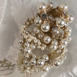 Elegant beige pearl and rhinestone elastic hair ties set with glossy finish and crystals