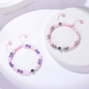 Close-up of projection stone bracelet with braided rope and polished beads detail