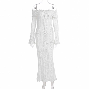 Detail of white lace off-shoulder dress with bell sleeves and delicate floral embroidery
