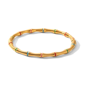 Detail of bamboo joint bracelet in 18k gold finish with colorful enamel accents