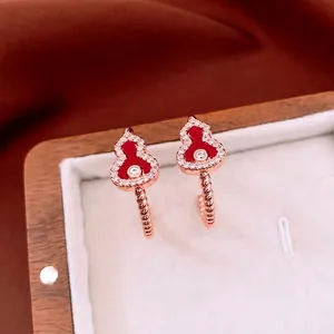 Elegant rose gold gourd earrings with red agate inlay and sparkling white cubic zirconia