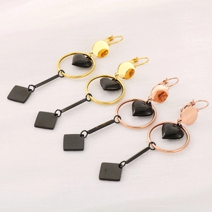 Fashionable geometric heart earrings in gold and rose gold with black accents