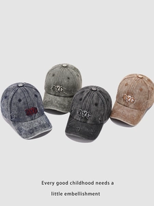 Detail showing washed denim baseball caps with DYC embroidery in four retro colors