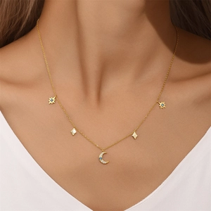 Close-up of S925 sterling silver gold necklace with opal moon and star pendants worn by model