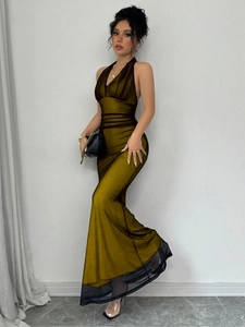 Close-up of olive green satin halter dress with mesh hem and elegant waist ruching