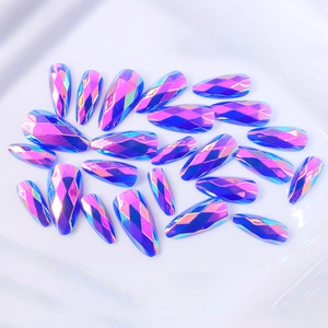 Detail of holographic purple almond press-on nails with 3D geometric faceted design