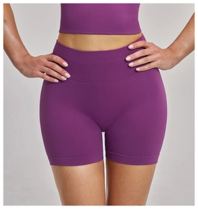 Close-up of seamless ribbed texture and high-waist fit on purple yoga shorts set