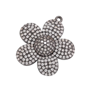 Sunflower pendant in dark plated brass with sparkling micro-pave crystals on white background