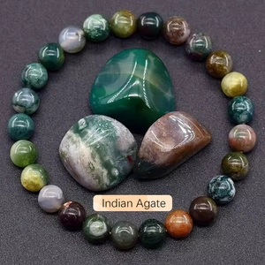 Detailed view of natural multi-color Indian Agate beaded bracelet on textured background