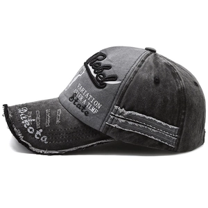 Distressed grey washed cotton baseball cap featuring vintage embroidery and frayed details