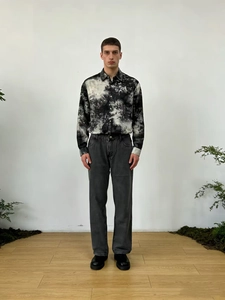 Men's relaxed fit casual jeans with vintage washed denim and tie-dye splatter print style