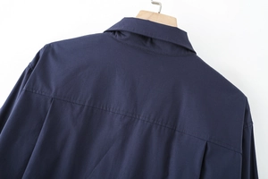 Detailed back view of navy blue cotton poplin shirt with precision stitching on yoke