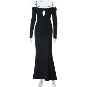 Detail of black off-shoulder dress featuring teardrop cutout and slim mermaid hem