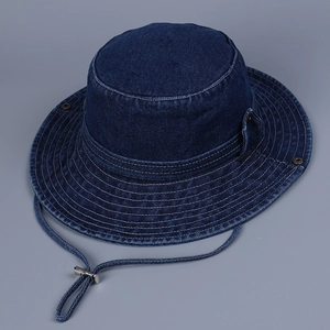 Detail of dark blue denim sun hat with wide brim, adjustable drawstring and metal vents