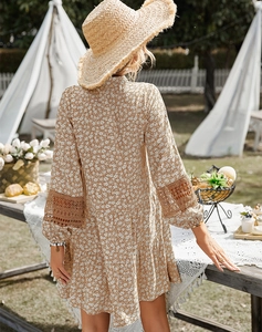 Detail of floral brown summer dress featuring intricate lace splicing on sleeve cuffs