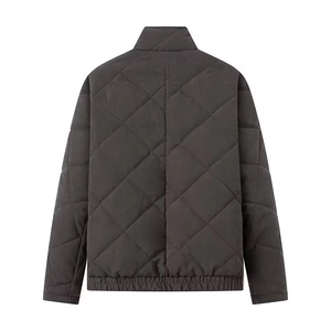 Macro view of dark grey quilted jacket back featuring vintage diamond patterns and stand collar
