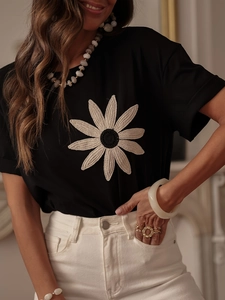 Slim fit black T-shirt with white daisy embroidery and soft breathable fabric