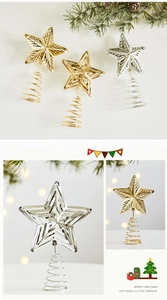 Close-up of gold and silver wire Christmas tree star toppers with spiral spring base
