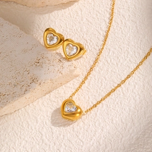 Detailed set of 18K gold stainless steel heart earrings and necklace with clear zircons
