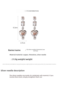 Detail view of rhinestone heart tassel earrings with dimensions and material specifications