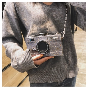Silver glitter camera bag with Steal The Spotlight text detail and metal chain strap