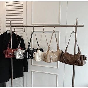 Collection of chic vintage leather underarm bags in six colors with metallic zippers