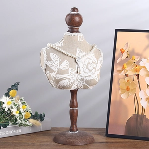 Beige floral fabric bust mannequin jewelry stand with solid wood base for necklaces