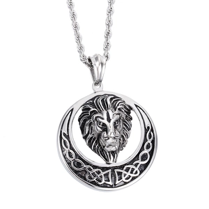 Macro shot of silver stainless steel lion head pendant with intricate celtic knot details