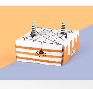 Detail of Halloween triangle cake gift box with spider web patterns and candle toppers