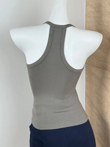 Detail of army green ribbed knit racerback tank top on a mannequin with slim fit texture