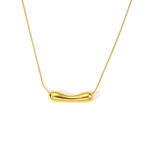 Close-up of polished gold snake chain with minimalist curved bean pendant on white background