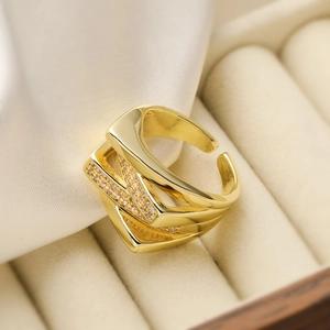 Luxurious gold-plated geometric open ring with shimmering zircon on white silk background