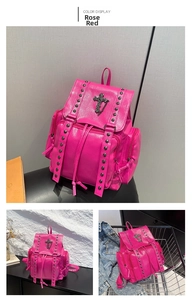 Detail view of rose red backpack featuring metallic cross pendant and punk rivet accents