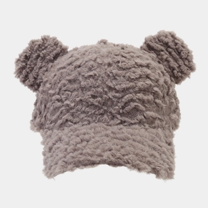 Close-up of soft plush taupe baseball cap featuring cute decorative bear ears