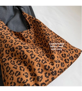 Close-up of soft leopard print tote bag fabric with plush suede-like texture detail