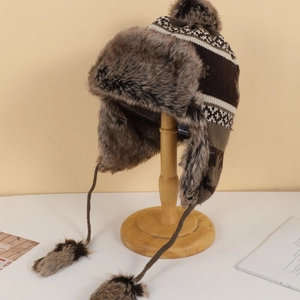 Detail of winter trapper hat with leopard pattern and soft faux fur lining for warmth