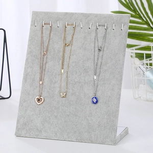 L-shaped light gray velvet jewelry display stand with hooks for necklaces and pendants
