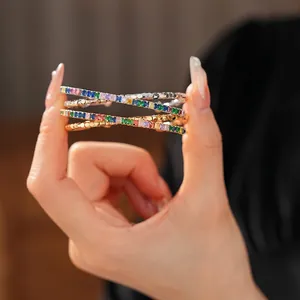 Multilayer stacked bracelet with colorful cubic zirconia and textured gold-silver finish