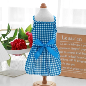 Close-up of blue plaid pet princess dress with silk bow detail and cotton fabric texture