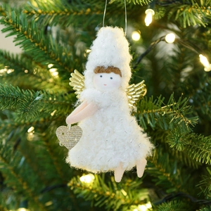 White plush Christmas angel hanging ornament with gold wings on a festive tree branch